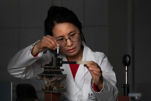 Cayian Tian adjusts the gas supply to the plasma.